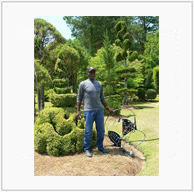 Pearl Fryar with His Love and Unity Sculpture
